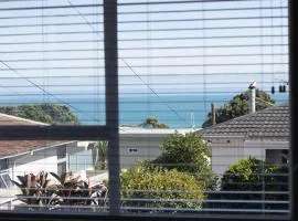 Blue Water Cottage - with beachfront coastal views