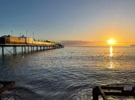 PINK HOUSE ,Opposite PIER & Beach ,SLEEPS 6 , 2 BEDROOM GROUND FLOOR SELF CONTAINED GARDEN FLAT , PRIVATE ENTRANCE , KITCHEN , Guaranteed Parking ,Wifi , Movies ,Bathroom ,fridge , microwave ,BEDROOM 1, DOUBLE BED & 2 SINGLE BEDS ,BEDROOM 2 , DOUBLE BED