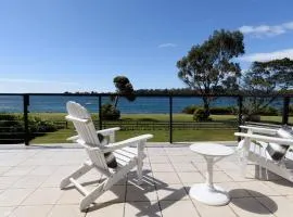 Sunset Sanctuary: Waterfront Home with Balcony and Patio