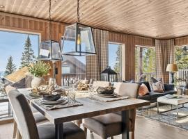Large family cabin at Hafjell with ski in-ski out, hytte i Hafjell