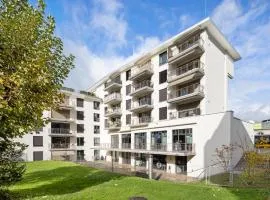 Visionary Hospitality Embrach, Zürich - Premium Apartments with Free Parking, Washer, Kitchen, Rooftop Terrace, Lounge, Bus Stop, Train Station, 15'Airport