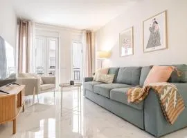 Central retreat with balcony, steps to beach REMS