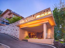 Zhangjiajie Shisuji Hotel (Zhangjiajie National Forest Park Sign Gate Branch), hotel v destinaci Hanqiyu