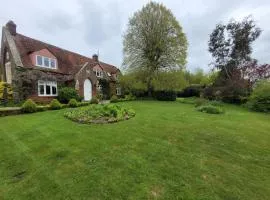 Old school house surrounded by countryside