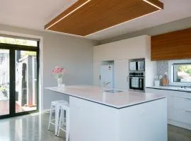 Sunny and Modern Nelson Retreat with Designer Kitchen
