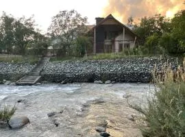 Birdsong 5BR Stay with Riverside by Homeyhuts