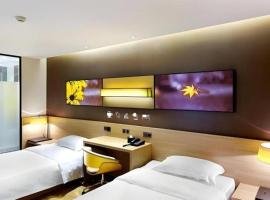 7 Days Premium Jingjiang Fuhai New World Automobile Terminal Branch, hotel v destinaci Jingjiang