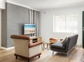 Suburban Two-bed Apartment with Parking and Patio