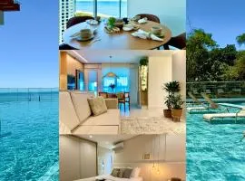 Apartamento em Condomínio Frente-Mar com Piscinas, Jacuzzi Aquecida, Sauna, Academia, Brinquedoteca, Churrasqueira na Sacada, Cozinha Completa e Lazer de Home Club