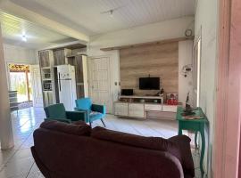 Casa de praia com piscina โรงแรมในอิมแบ