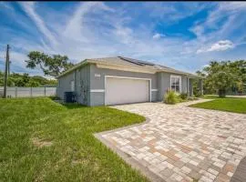 Newer Construction Home in Port Richey 3BR 2BA Bright with High Ceilings, Screened Lanai & Lake View, Fully Furnished, Conveniently Located on a Corner Lot with No Front Neighbors, Short Walk to US-19, Shops & Restaurants