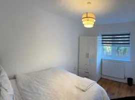 Comfortable double room with shared spaces