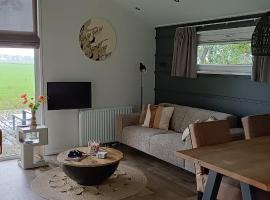 Luxe lodge met vrij uitzicht over landerijen - FEAN nature lodge、Oosterwoldeのホテル