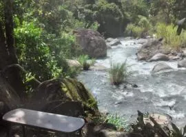 Rustic two bedroom house right by the Chirripo river