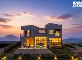 StayVista at Aria by the Hills with Pool, Lawn, Wi-Fi