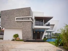 JD Beach Vacay 4-BHK Oceanfront Beach Villa with Spacious Lawn, Ambient-Lit Bar & Private Beach Access