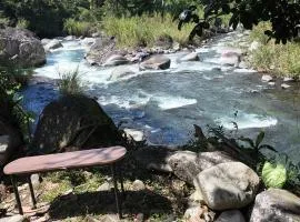 Rustic two bedroom house right by the Chirripo river