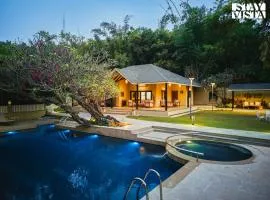 StayVista's Lush Villa - Rustic-Meets-Modern Interiors, Pool, Jacuzzi & Indoor activities