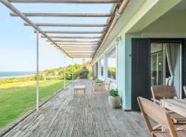 Moradia Milú frente à praia