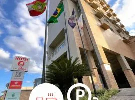 Le Village Flats e Hotel