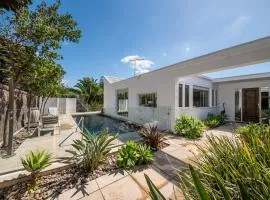 Skomer House Portsea with gas heated pool. Steps to beach and Portsea Pub