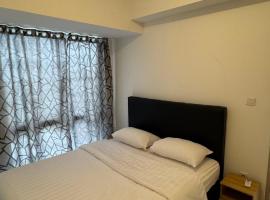 Cozy Minimalist Two-Bedroom Apartment by Jiu Zhai 九寨: Muara şehrinde bir otel