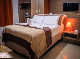 CONFORTO IMBATIVEL - 25 metros do MAR - 2 Quartos com AR CONDICIONADOS SPLIT, Air Fryer, WI-FI, Disney Plus, Star Plus, HBO Max, Guarda Sol, Cadeiras de Praia e Caixa Térmica - 8 pessoas com Muito Conforto - Melhor Localização!, Hotel in Guarapari