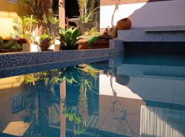 Pousada Casa Jardim, отель в городе Серра-Негра
