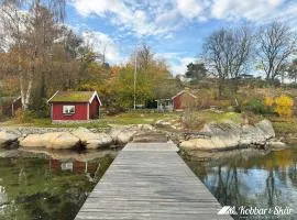 Dog-friendly cottage with boat & private jetty at Tjörn SE09170
