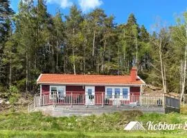 Fresh cottage with lake view and rowing boat SE09156
