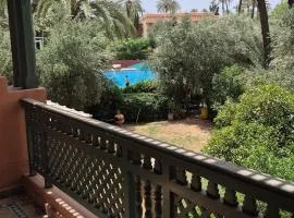 Chic Palm Grove Apartment Pool View