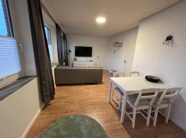 Vier Nordlichter EG-Wohnung mit direktem Gartenzugang, Hotel in Bensersiel