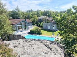 Architect-designed villa with pool, sauna and sea view in Mjörn SE09124, Hotel in Hjälteby
