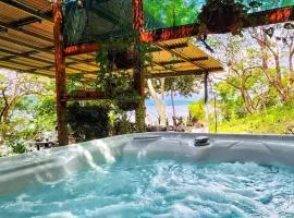Teak house in a forest above the beach