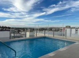 Apartment with rooftop pool 150 m from the beach