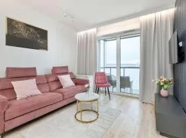 Elegant Apartment with Balcony and Underground Parking by Noclegi Renters