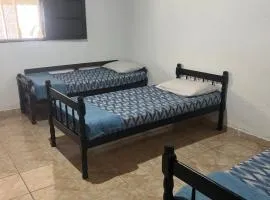 Quarto privativo em casa de praia próxima a cachoeira