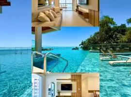 Apartamento em Condomínio Frente-Mar com Piscinas, Jacuzzi Aquecida, Sauna, Academia, Brinquedoteca, 3 quartos Churrasqueira na Sacada, Cozinha Completa e Lazer de Home Club