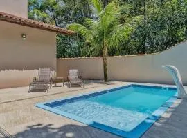 400 m te Separam das Areias da Praia de Boraceia, casa com piscina aquecida para ate 12 pessoas