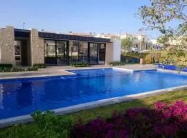 House A in a residential condominium with a pool