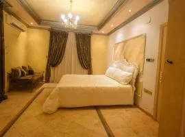 راحة القصر - شقق غرفة نوم وغرفة معيشة بتصميم كلاسيكي