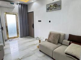 Wii Apartments and Suites, hotel con estacionamiento en Mama