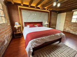 Cabaña en el Campo Malchinguí WIFI 24 horas, hotel i Malchinguí