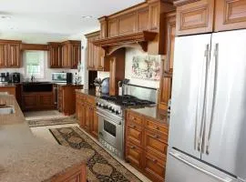 Large home with hot tub in serene wooded setting