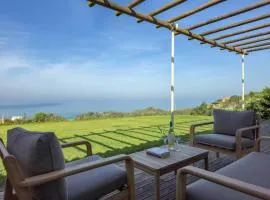 Moradia Milú frente à praia