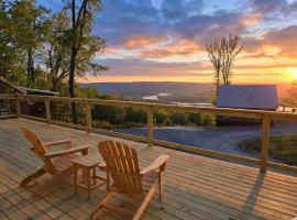 This is IT Cabin with a hot tub fire pit & indoor pool, hotel i Bryant