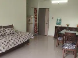 1 big furnished studio apartment with a pantry including fridge, utensils, gas stove and a washing machine with attached bathroom that can accommodate minimum 4 people