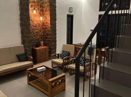 Asramom Home, hotel em Coulão