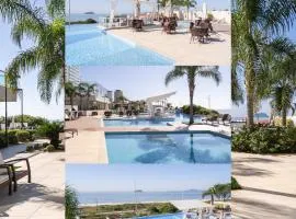 Apto Frente Mar Bali Beach Home Club 3 Quartos Climatizados Cozinha Completa Sacada com Churrasqueira 2 Vagas de Garagem Piscina borda infinita Sauna Academia Cinema Quadra Salão de Jogos Pé na Areia 15min do Beto Carrero