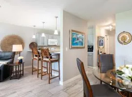 Tropical condo with pools lanai & BBQ